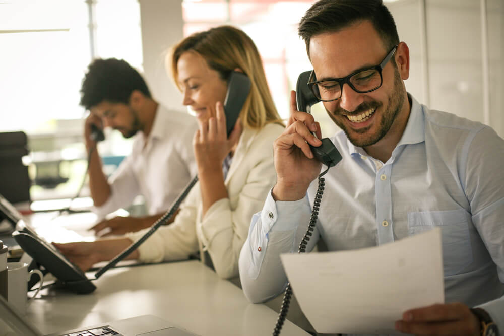 People on Phones Happy people answering phones.
